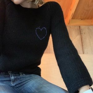 Black sweater with a blue heart